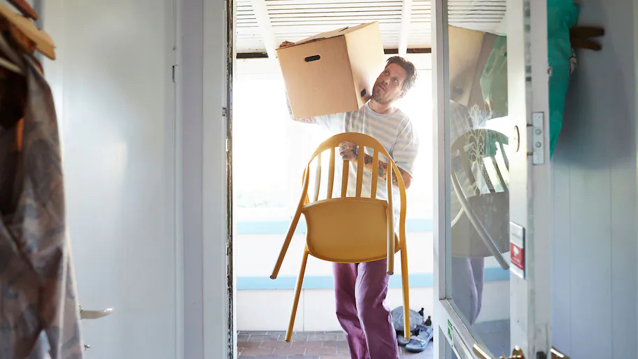 Man carrying a chair